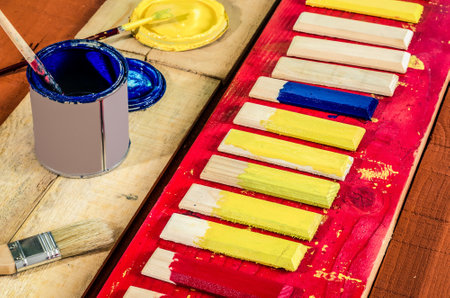Brushes , paint and wooden boards . Painting the boards with colored paints.の写真素材