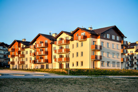 New housing estates in Tychy City, Poland. Public view of newly built block of flats in the green area.の写真素材