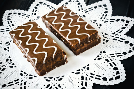 Table setting with cookies with chocolate. Chocolate coated biscuits on a white napkin.の写真素材