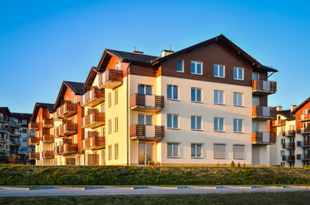New housing estates in Tychy City, Poland. Public view of newly built block of flats in the green area.の写真素材