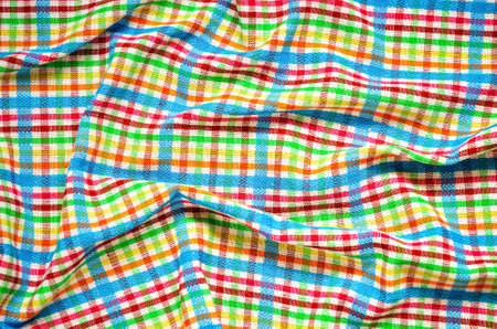 Wrinkled texture material rag. Colorful fabric background checkered.