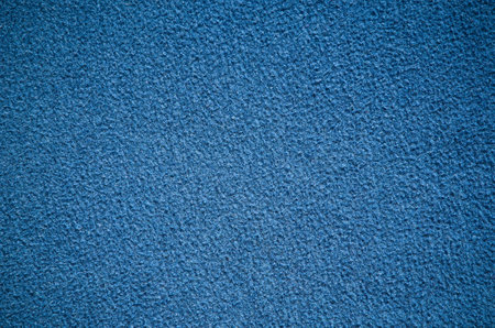 Furry blanket texture. Close-up of blue textile material, may be used as background.