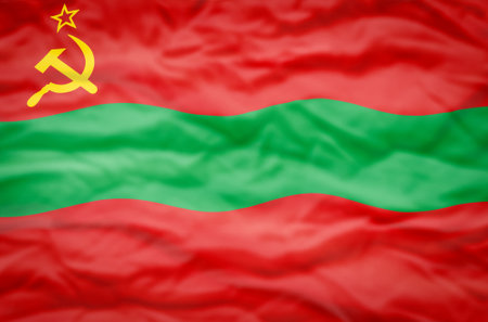 Transnistria flag on a wavy background. Wavy flag of Transnistria fills the frame.の写真素材
