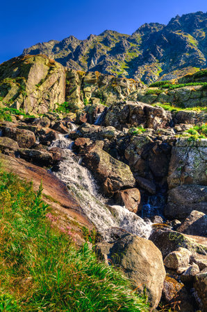 Summer mountain landscape in Slovak mountains. Beautiful waterfall in High Tatra, Slovakia.の写真素材