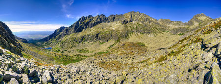 Summer mountain landscape in a panoramic perspective. View of a beautiful mountain valley in High Tatra, Slovakia.の写真素材