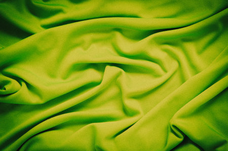 Lime wrinkled fabric texture. Close-up of soft cotton cloth, may be used as background.の写真素材