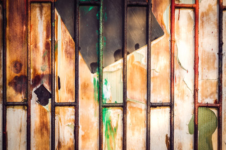 Old metal wooden door. Background of metal door with wood inside.の写真素材