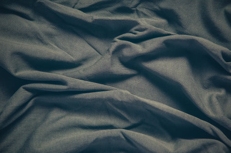 Wrinkled fabric texture. Close-up of soft cotton cloth, may be used as background.の写真素材