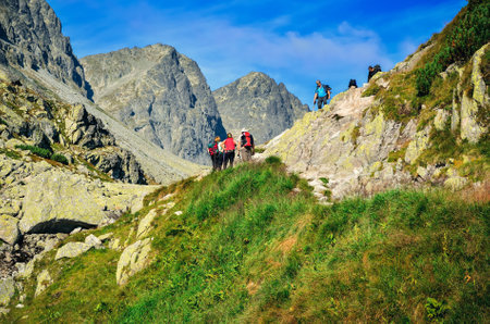 High Tatra, Slovakia - August 19, 2015: Tourists climbing on a mountain peaks in High Tatra, Slovakia.のeditorial素材