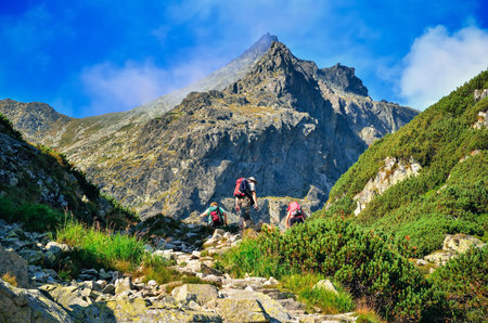 High Tatra, Slovakia - August 19, 2015: Tourists climbing the mountain peaks in High Tatra, Slovakia.のeditorial素材