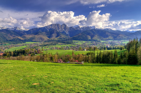 Beautiful spring mountain and rural landscape. View on the Tatra Mountains and Koscielisko Village in Poland.の写真素材