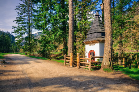 Trail in the Polish Tatra Mountains. The shrine on the trail in Koscieliska Valley in Tatra Mountains, Poland.の写真素材