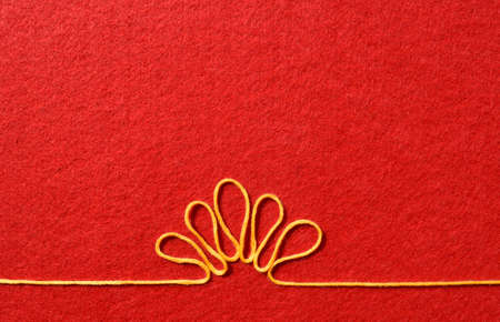 Valentines day card - flower made from wire on red backgroundの写真素材