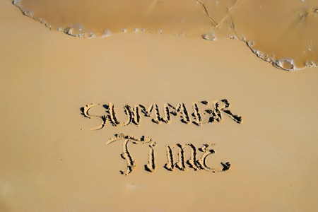 Inscription "Summer Time" in the sand on a tropical islandの写真素材