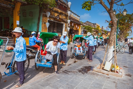 HOI AN, VIETNAM - MARCH 15, 2017: local Vietnam man riding a traditional cycle in Hoi An. Hoi An, is a major touristic destination in Central Vietnamのeditorial素材