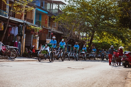 HOI AN, VIETNAM - MARCH 15, 2017: local Vietnam man riding a traditional cycle in Hoi An. Hoi An,  is a major touristic destination in Central Vietnamのeditorial素材