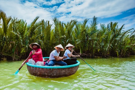 HOI AN, VIETNAM - MARCH 19, 2017: Tourists visit water coconut forest in Hoi Anのeditorial素材