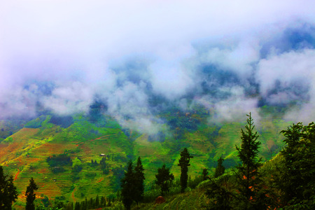 White clouds cover the mountains rocky Global Geopark in Ha Giang, Vietnamの写真素材
