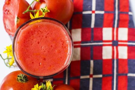 Fresh tomato juice isolated on white backgroundの写真素材
