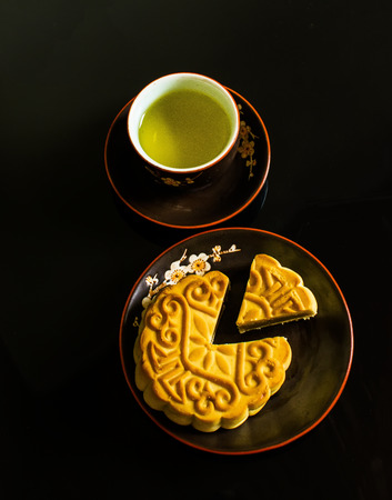 Moon cakes for the Chinese Mid-autumn festival isolated on black background