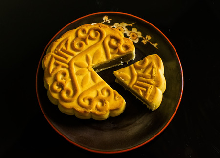 Moon cakes for the Chinese Mid-autumn festival isolated on black backgroundの写真素材