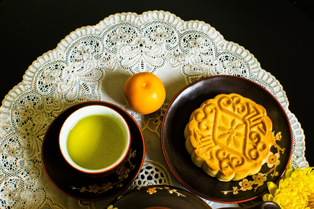 Moon cakes for the Chinese Mid-autumn festival isolated on black backgroundの写真素材