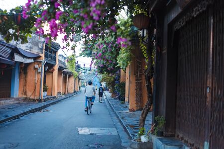 HOI AN, QUANG NAM, VIETNAM, SEPTEMBER 20, 2018: Vietnam people,Vietnamese ride bicycle on during...