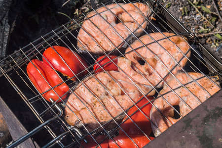 The Norwegian trout on coals, on a latticeの写真素材