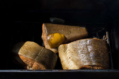 The Norwegian trout in the smoking shed with a hot smokeの写真素材