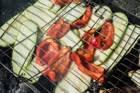 Vegetable marrows and pepper baked on coals on a latticeの写真素材