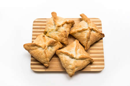 Quadrangular fruit fresh blackcurrant pies from puff pastryの写真素材