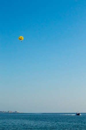 Flight on a parachute over a sea scopeの写真素材