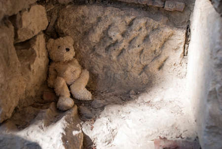 The toy left by someone in old ruinsの写真素材