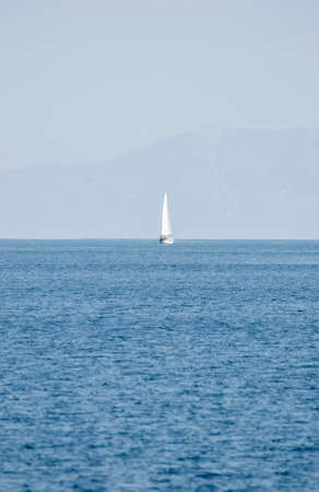 The yacht at the quiet blue seaの写真素材