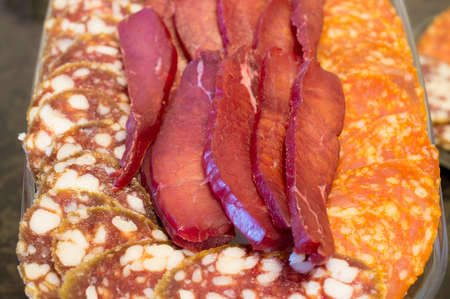 Smoked sausage of different grades and dried meatの写真素材