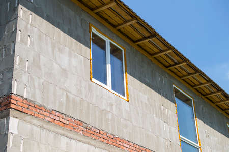 The house from foam concrete blocks with a roof and windowsの写真素材