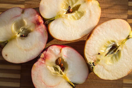 The juicy ripe apples cut in halfの写真素材