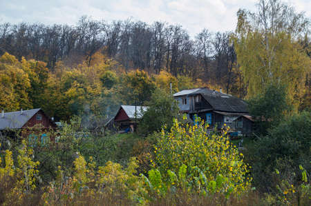 Some small wooden houses in the autumn woodの写真素材