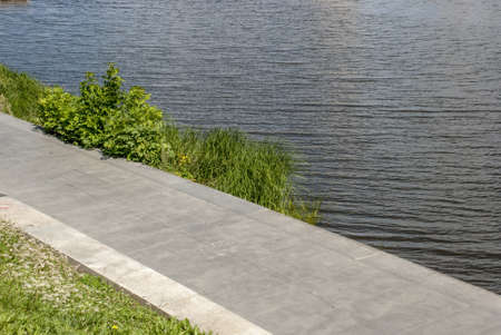 The city river from the embankment in the summer