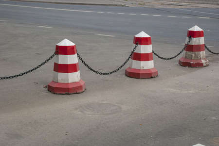 The concrete painted restrictive column and chainの写真素材