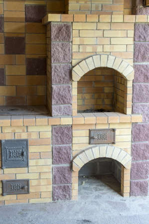 The furnace with a plate and a fireplace with a grillの写真素材