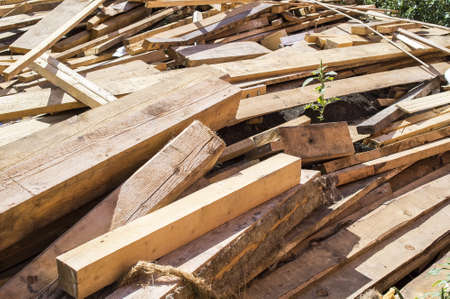 Wooden linear materials: unpainted boards and barの写真素材