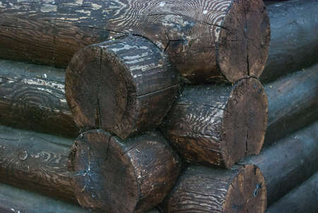 The corner of the wooden house from logsの写真素材