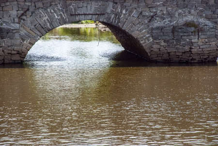 The old city bridge on the river