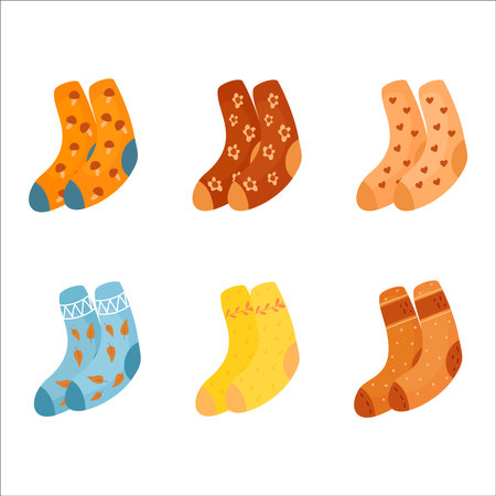 Six pairs of autumn cute socks. Warm cozy autumn, stay at home. A collection of warm multi colored flat socks isolated on a white background.のイラスト素材