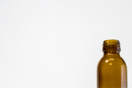 Close-Up of Empty Energy Drink Bottle on White Backgroundの写真素材