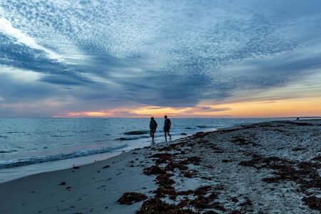 Couple on the evening beach in Perth, Western Australia