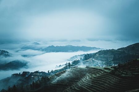 the scenery of Longji terraced fields in Guangxi, the clouds shrouded the distant mountains.の写真素材