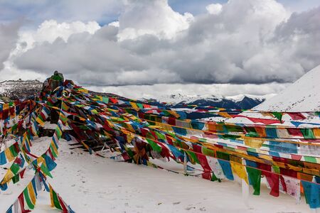 Prayer flags on the mountain pass in Tibetの写真素材