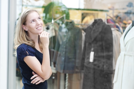 young Beautiful woman in mall think about shoppingの写真素材